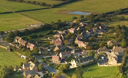 Group of houses with greenery from a bird eye view.