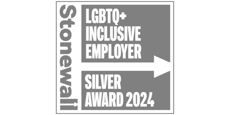 Stonewall LGBTQ+ Inclusive Employer Silver Award 2024 badge, featuring bold white text on a grey background with a large white arrow pointing right