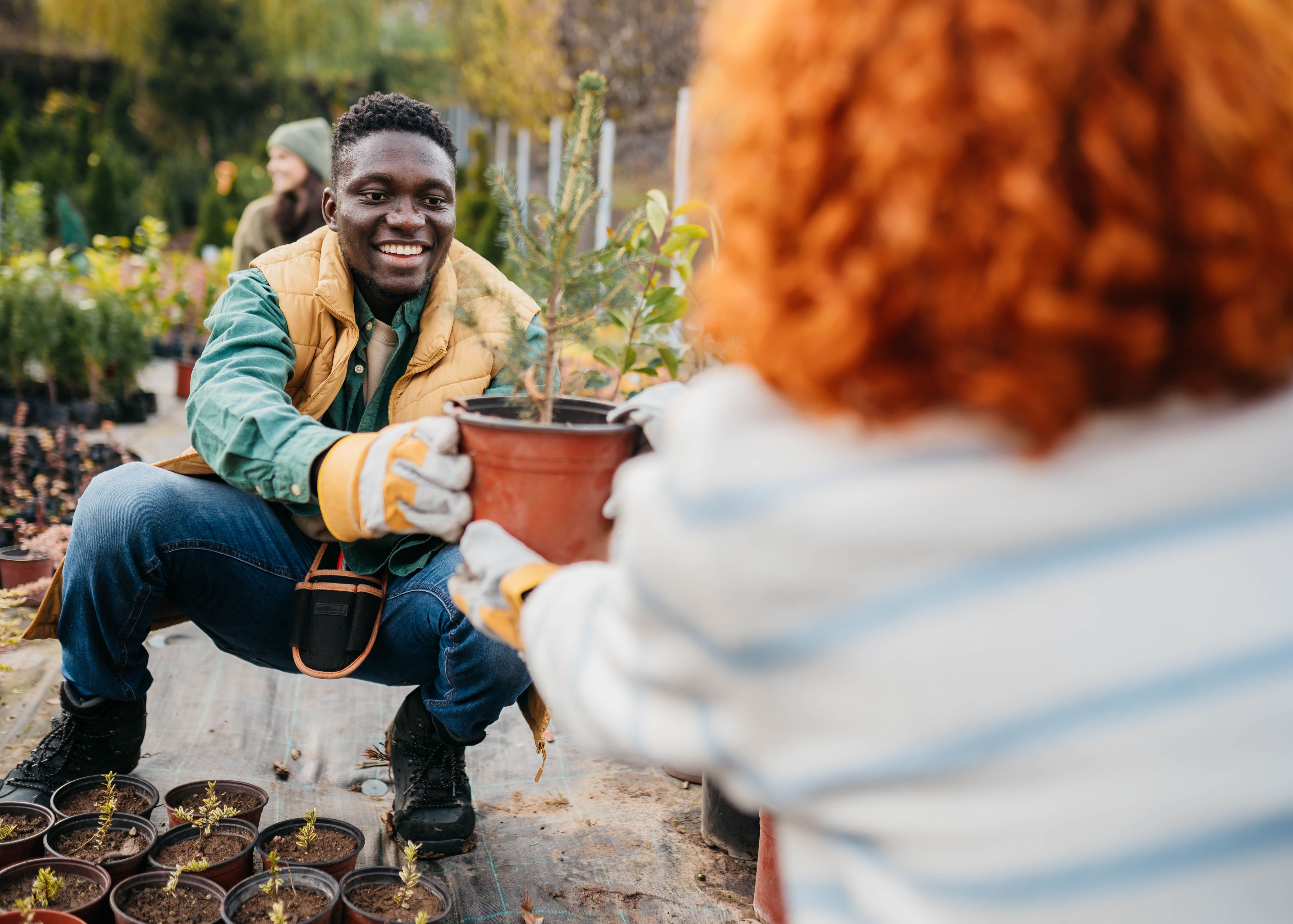 Group of young volunteers working on a community garden